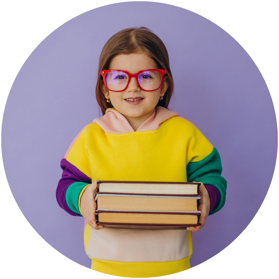 school readiness girl with glasses holding books