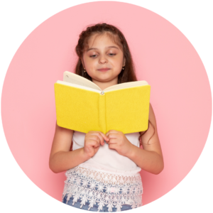 young school girl reading from book