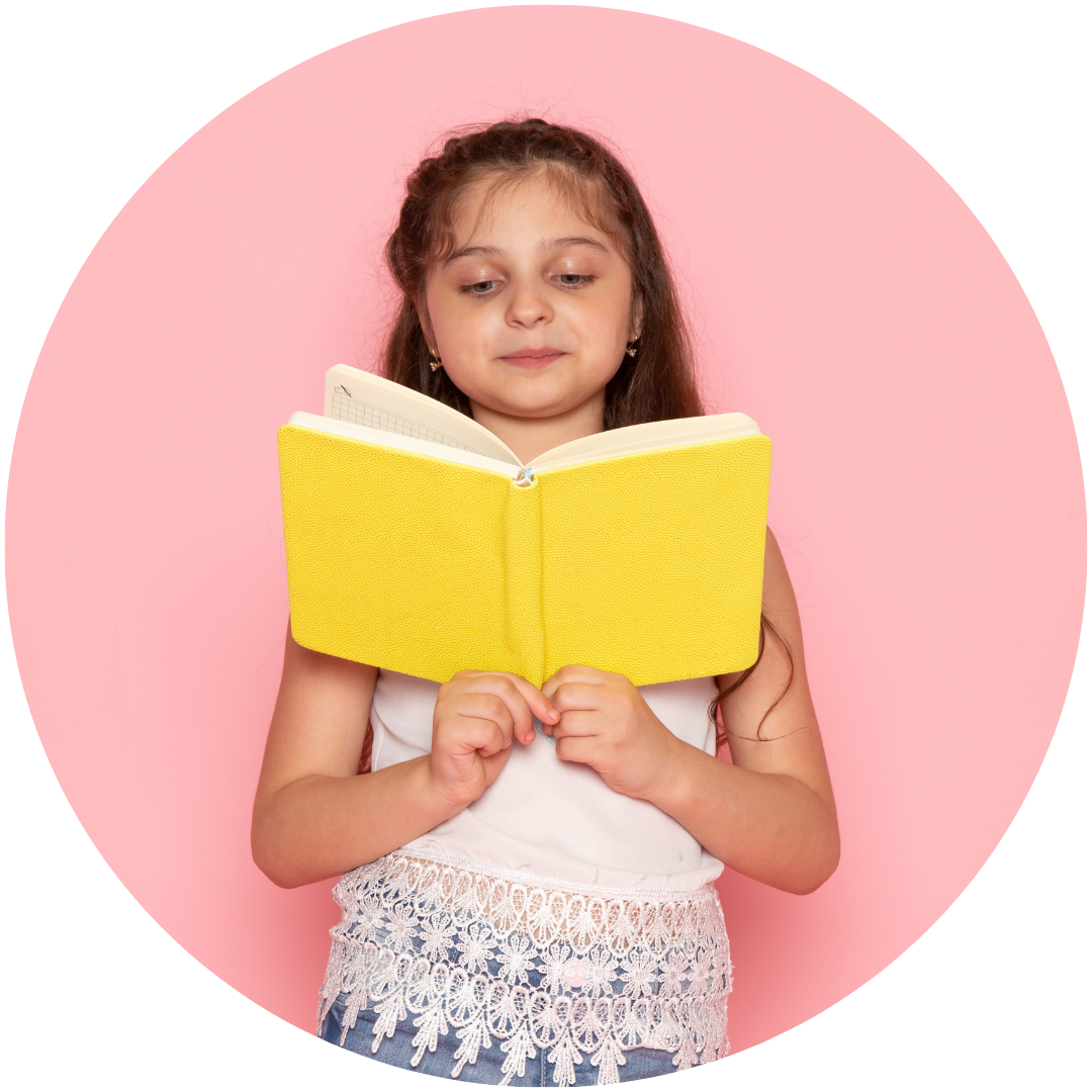 young school girl reading from book